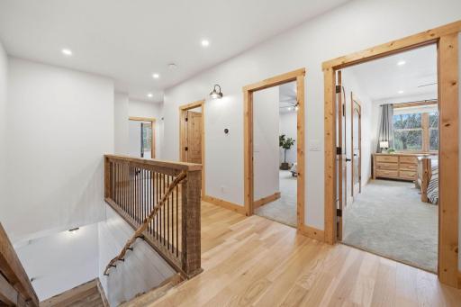 Head upstairs and find three additional bedrooms, two baths, and a kitchenette.