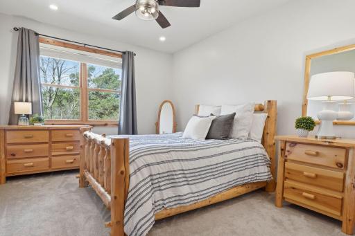 One of three upstairs bedrooms is full of natural light.