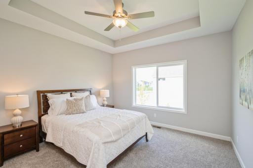Primary bedroom - photo is of a staged model home with same floorplan