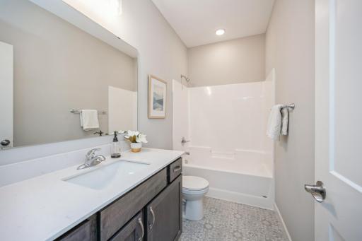 Main full bath - photo is of a staged model home with same floorplan