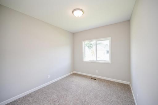 Bedroom 2 - photo is of a staged model home with same floorplan