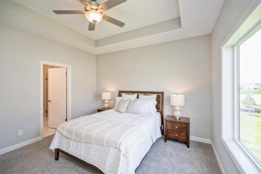 Primary bedroom - photo is of a staged model home with same floorplan