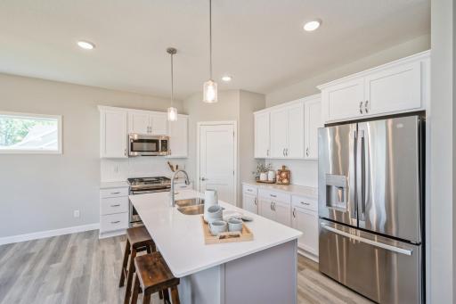 Kitchen - photo is of a staged model home with same floorplan