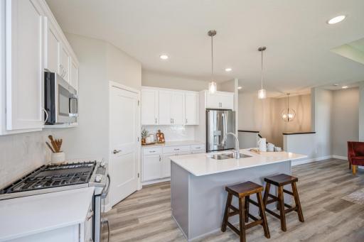 Kitchen - photo is of a staged model home with same floorplan