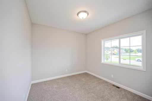 Bedroom 1 - photo is of a staged model home with same floorplan