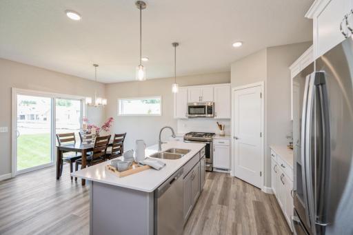 Kitchen - photo is of a staged model home with same floorplan