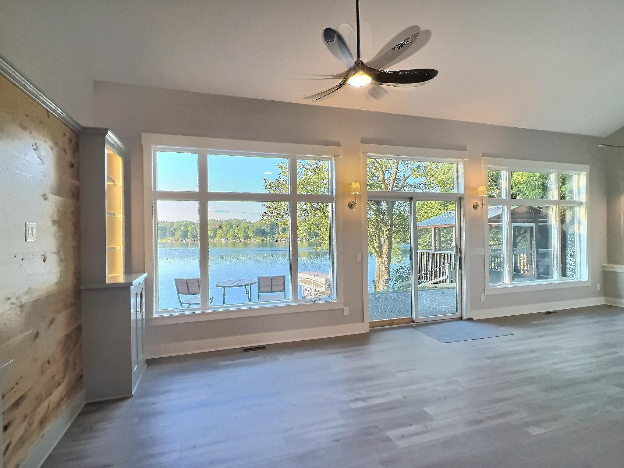Expansive collection of lakeside windows provide panoramic water views and fill the space with natural light. Views to be enjoyed all day long.