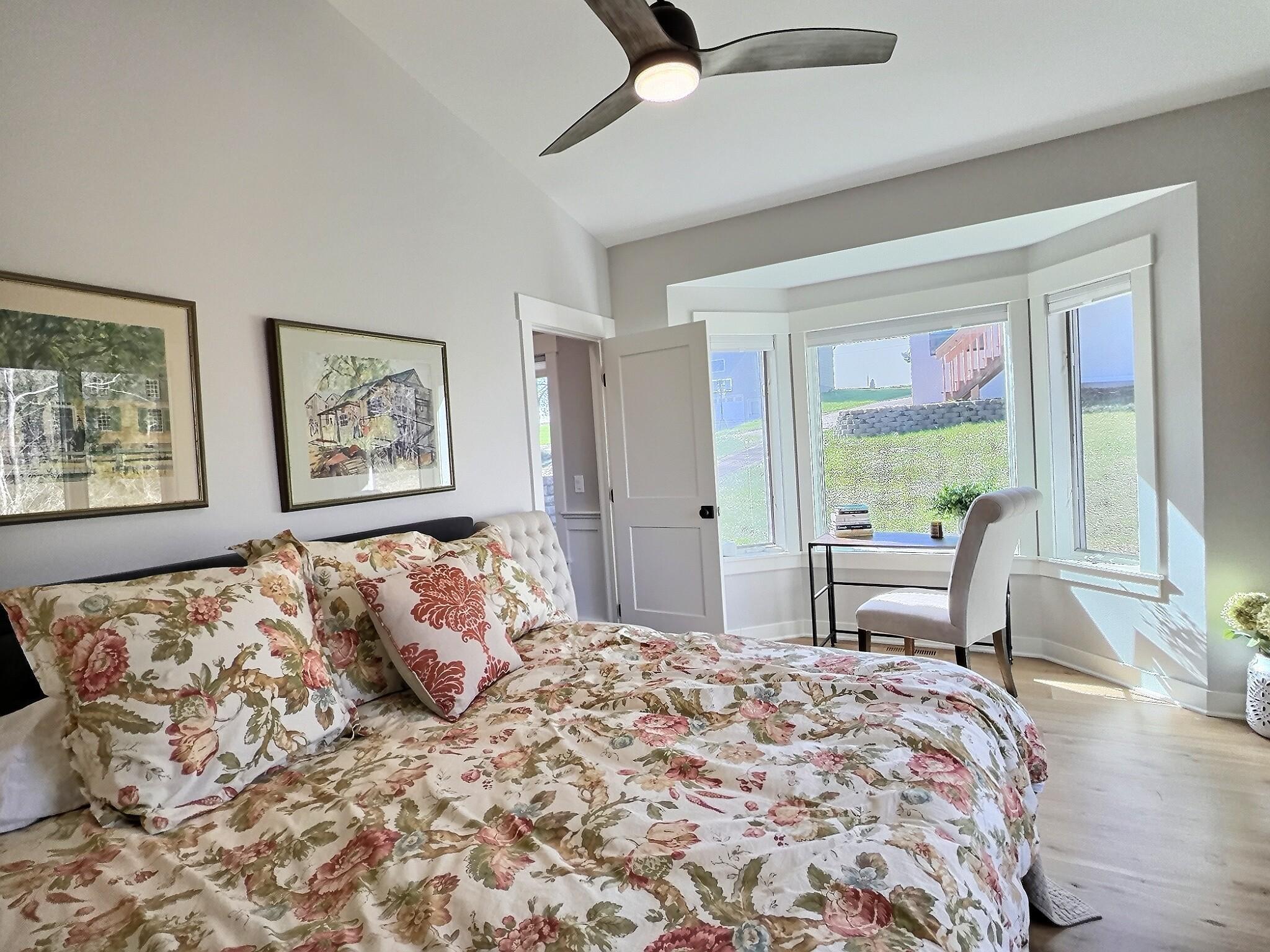 The main level bedroom has plenty of natural light that lights up this room and offers great views of the outside.