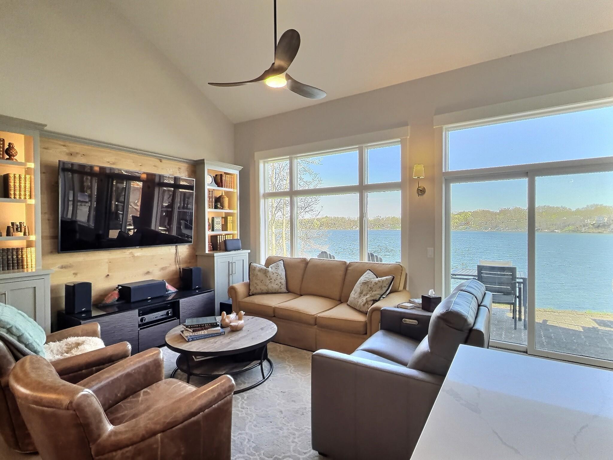 Step inside to discover a fresh, contemporary interior featuring numerous upgrades throughout. Living room area sits overlooking the lake.