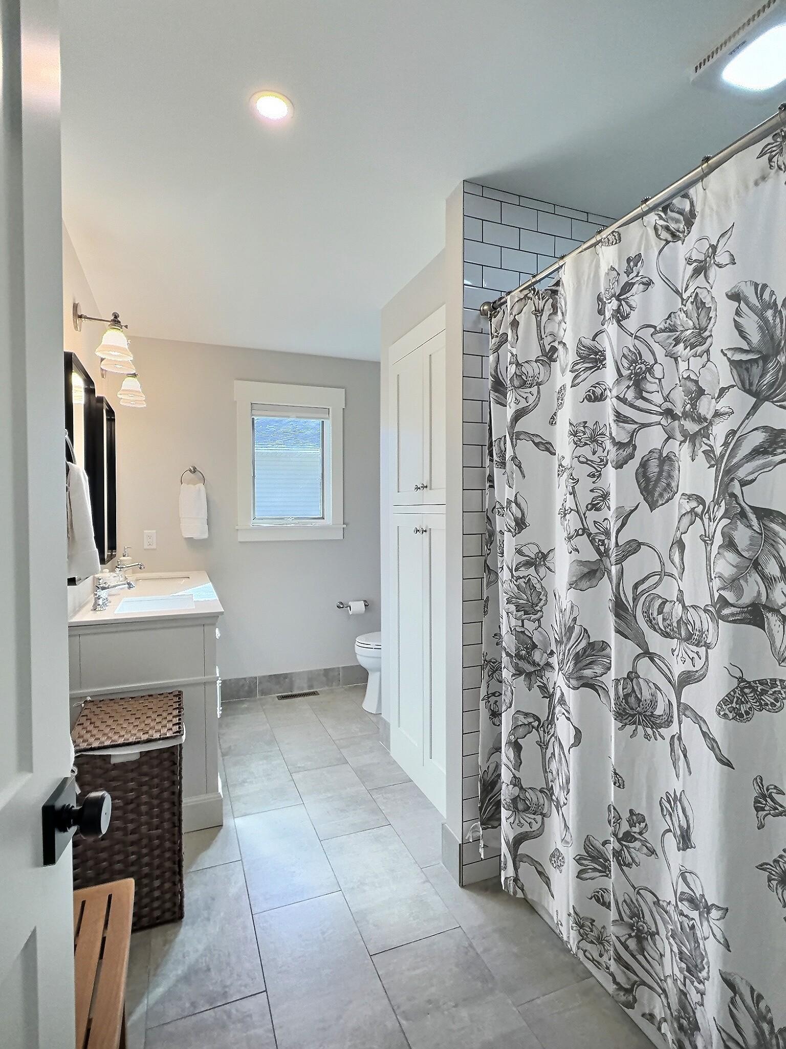 The upper level bath also has been redone with fresh modern flair.