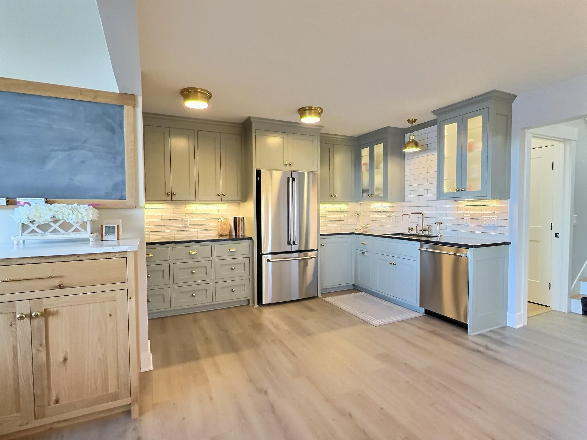 Kitchen has been completely redone with new lighting, cabinets, appliances and soap stone countertops.
