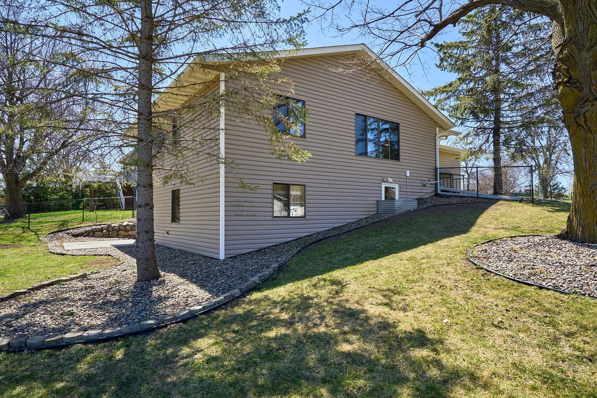 Lower level walks out to a patio and a fully fenced park-like yard.