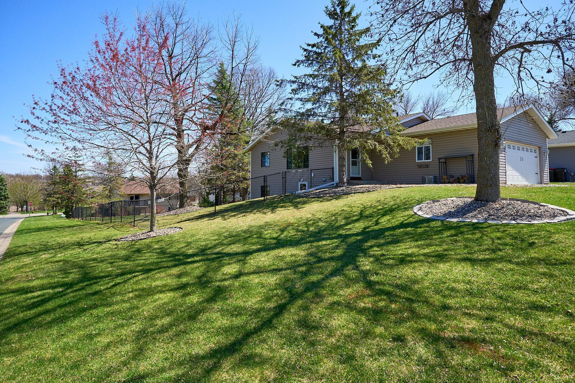 This spacious corner lot includes a Honey Crisp apple tree, a Jonathan Stark apple tree, a Bartlett pear tree, and a young grape vine.