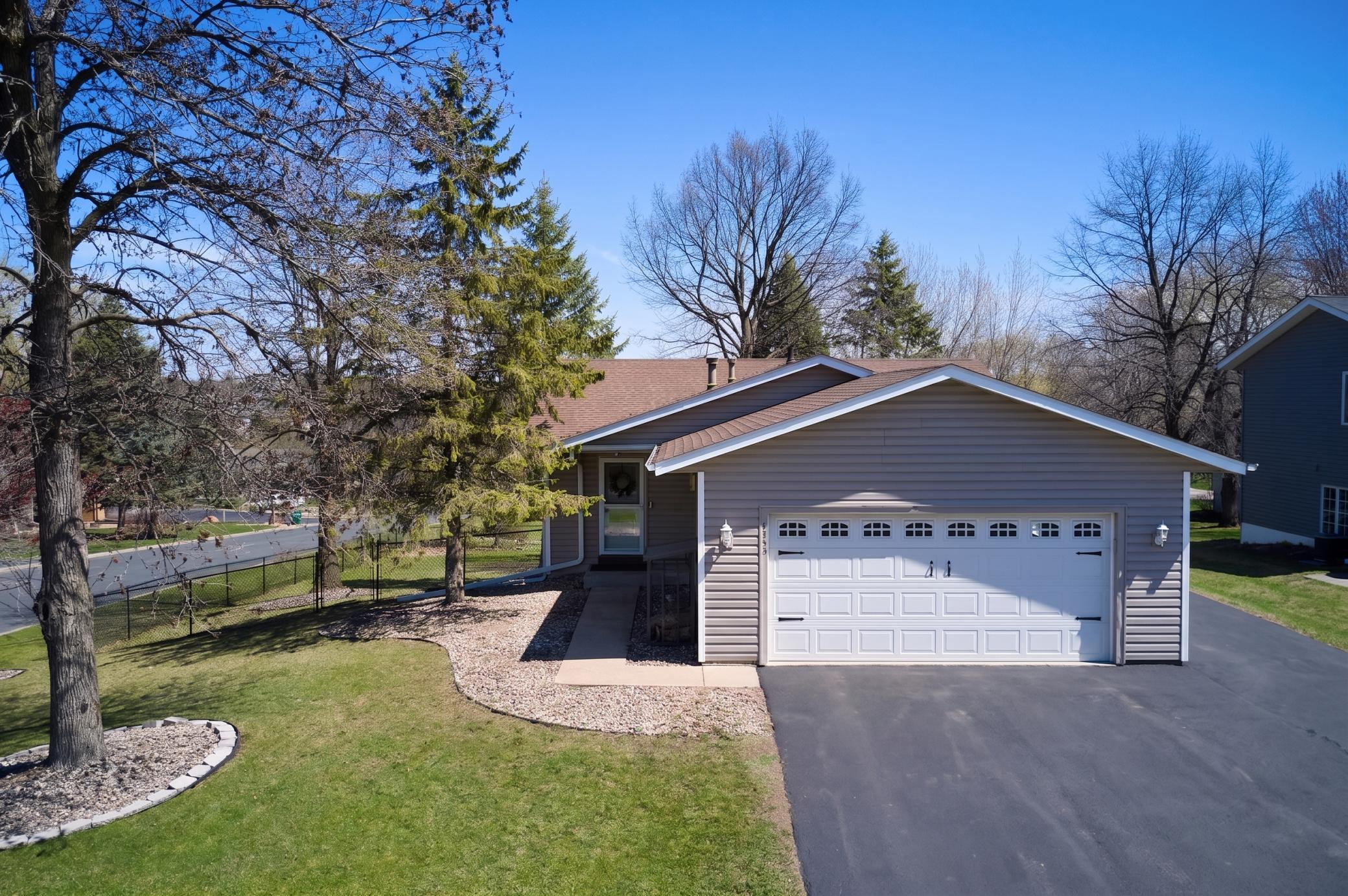 4-bed, 2-bath walkout rambler on a corner lot. 2-car heated garage with extra parking spot on the side.
