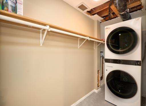 Laundry room, with a new stackable washer & gas dryer, is on the walk-out level