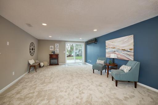 Large walk-out level family room opens to the patio & fenced yard