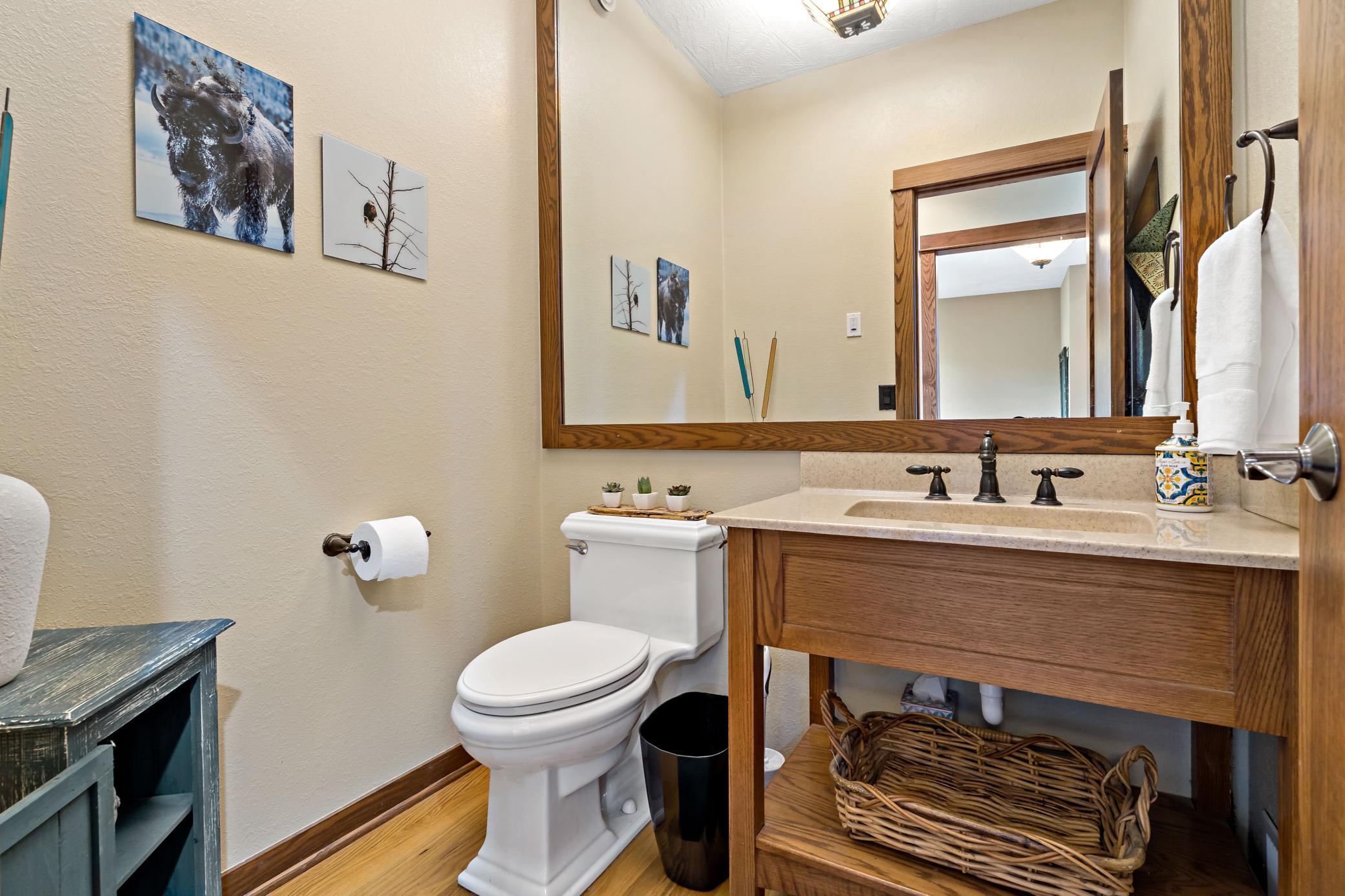 1/2 bath on the main has a remarkable wall to wall mirror that you really must see in person!