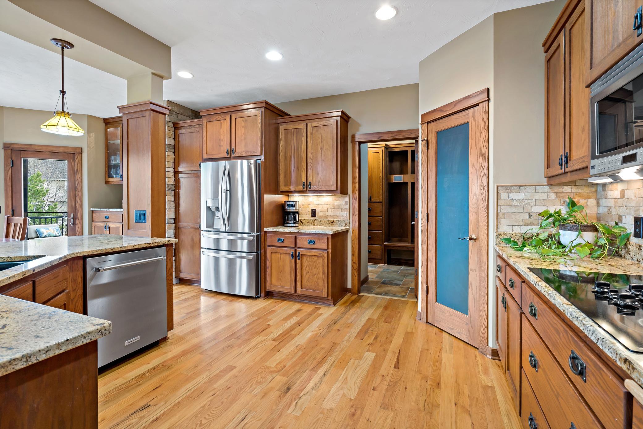 Functional and adorable walk in pantry...as if you needed more storage! Chalk board door is the perfect place for messages to family members or to keep your grocery list current.