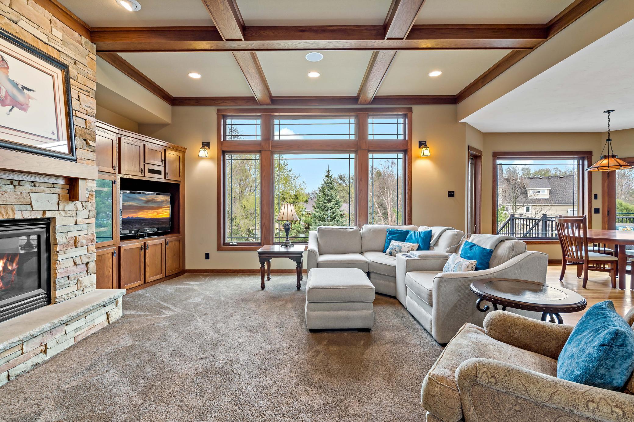 Upon entry at the front door you are greeted by this stately ceiling and enormous windows.