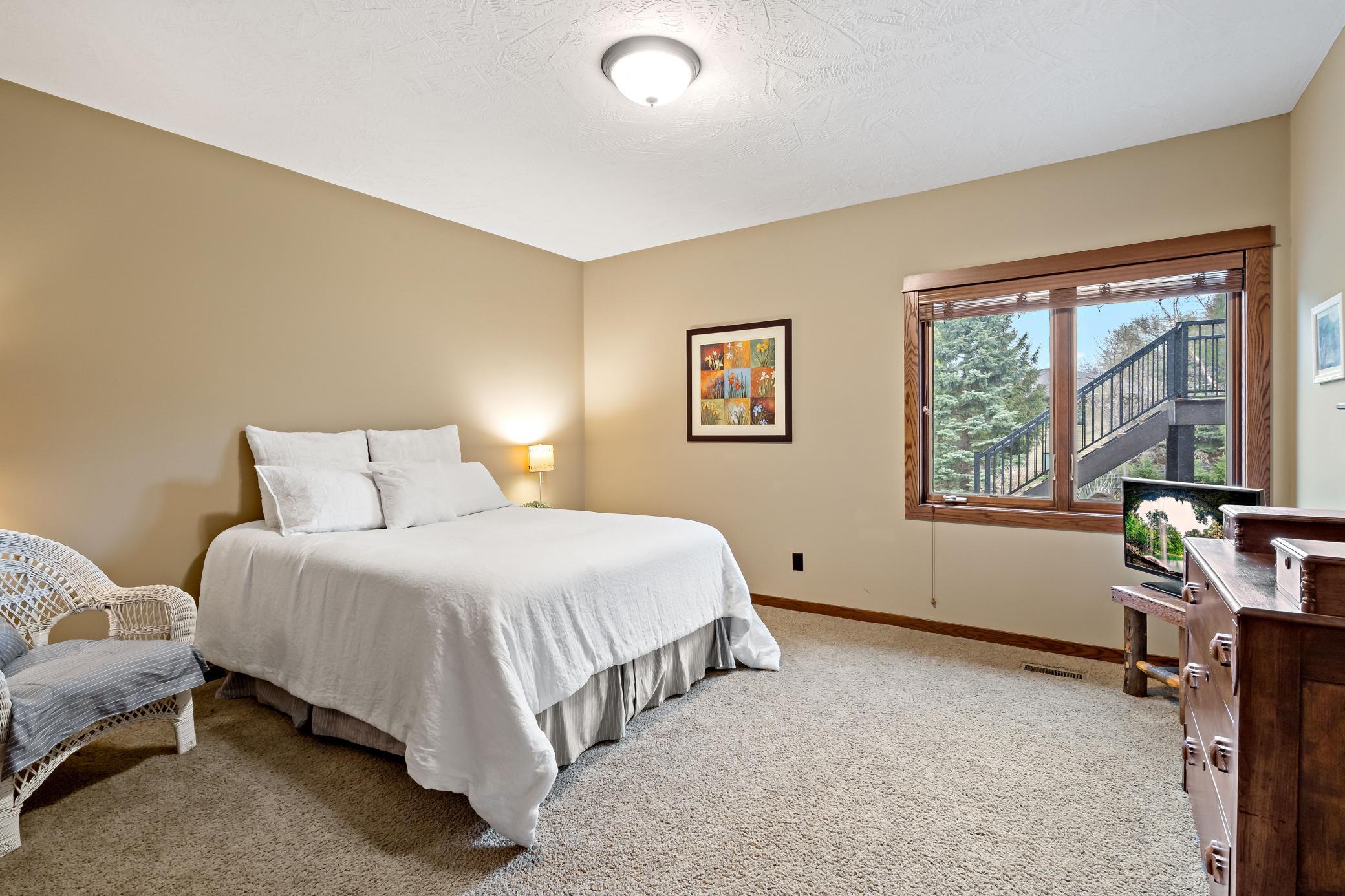 One of three large bedrooms on the lower level. Neutral paint and carpeting are ready for you to move right in!