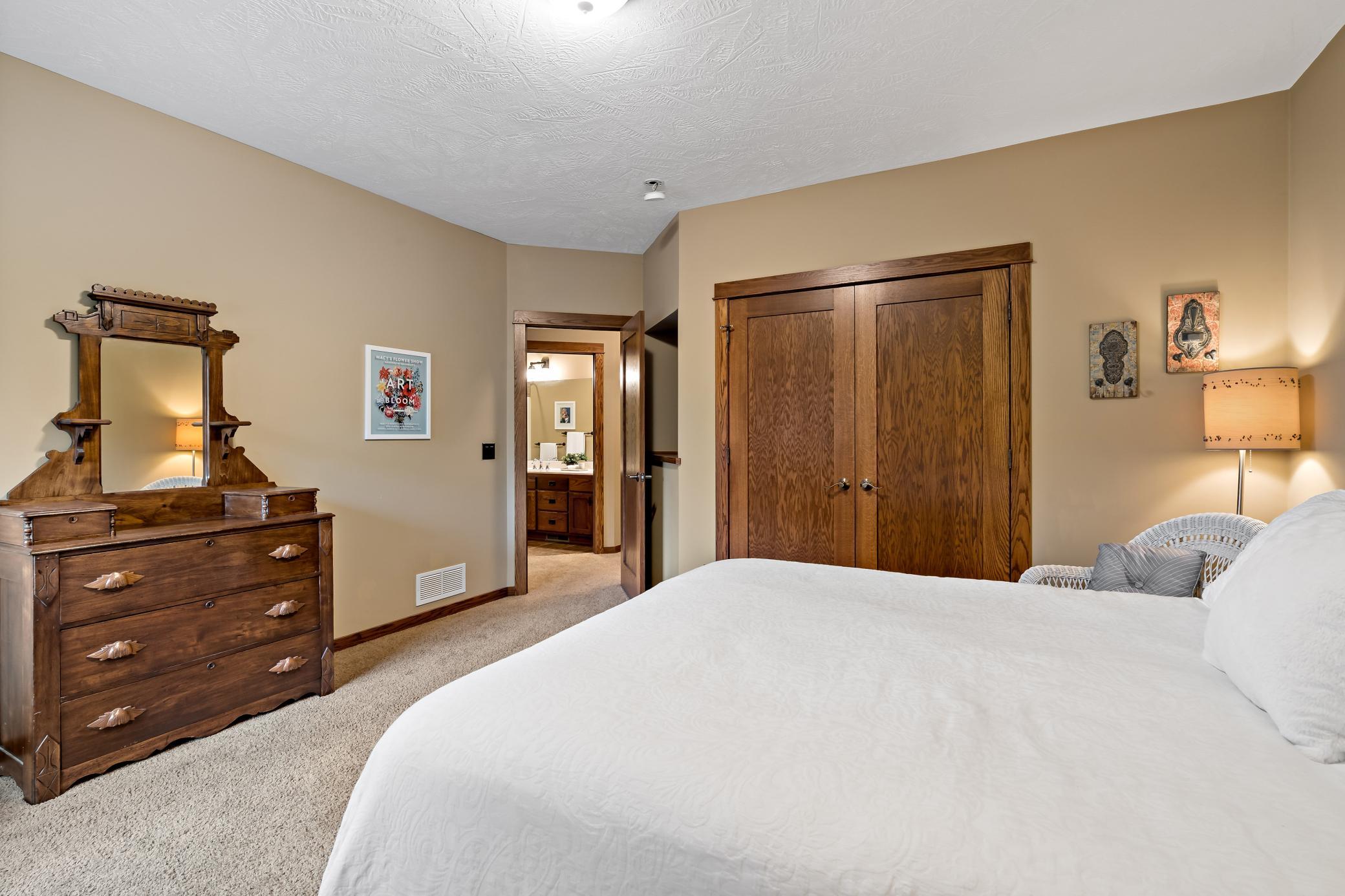 Large closet with stunning doors and an automatic light when the door is opened.