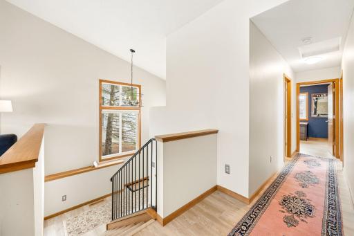 Fresh paint on handrail and new light fixture in foyer