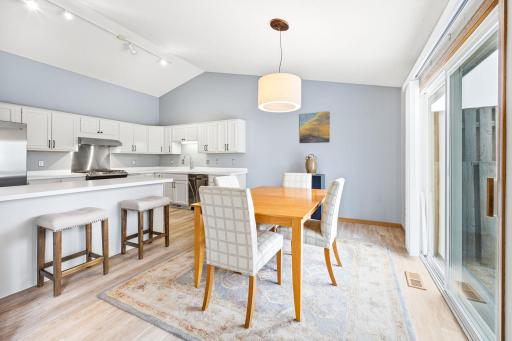 Dining area has easy access to private, maintenance free deck