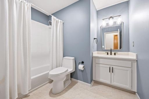 Enameled cabinet, new countertop, hardware, mirror and lighing