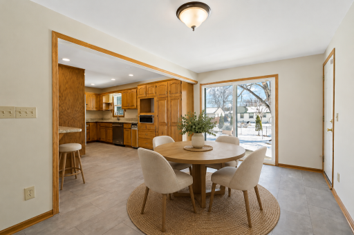 Virtually staged dining room with a stool .png