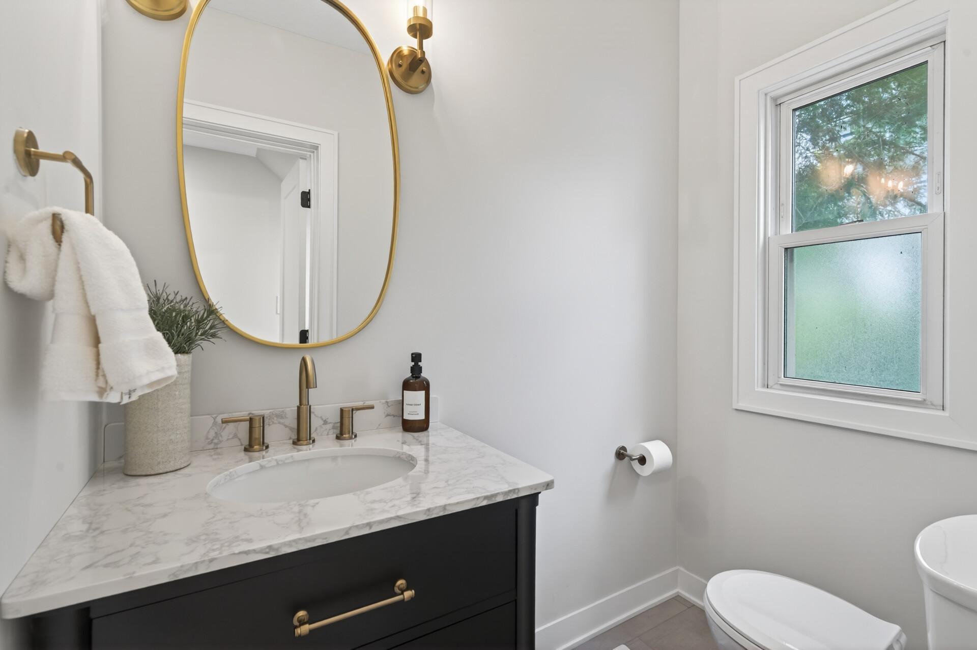 Convenient, fully updated powder room, along with generous storage options thoughtfully integrated throughout the level.