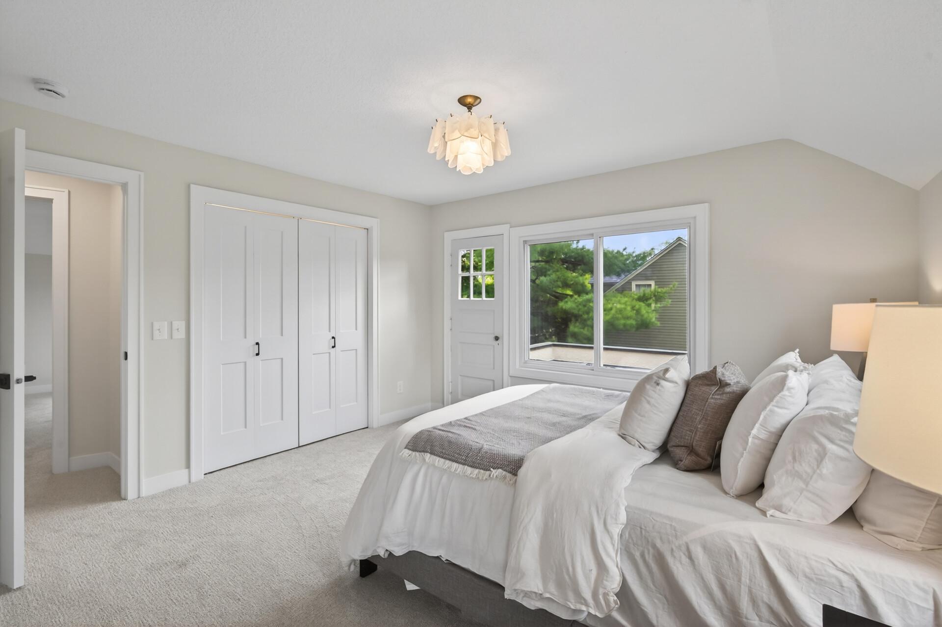 Complete with new Shaw carpeting and dual closets (including a generous walk-in with custom organization).