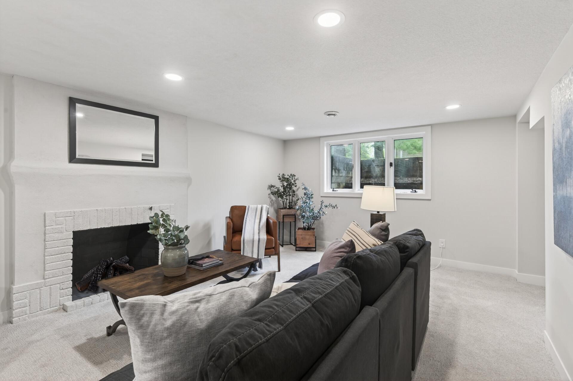 The family room features a non-functioning brick fireplace that adds character, along with a comfortable, open layout ideal for movie nights or game days.