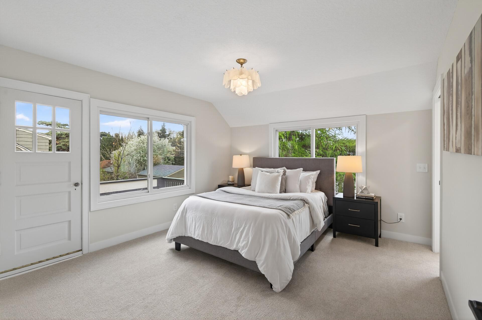 The expansive, upper-level primary suite feels like a retreat.