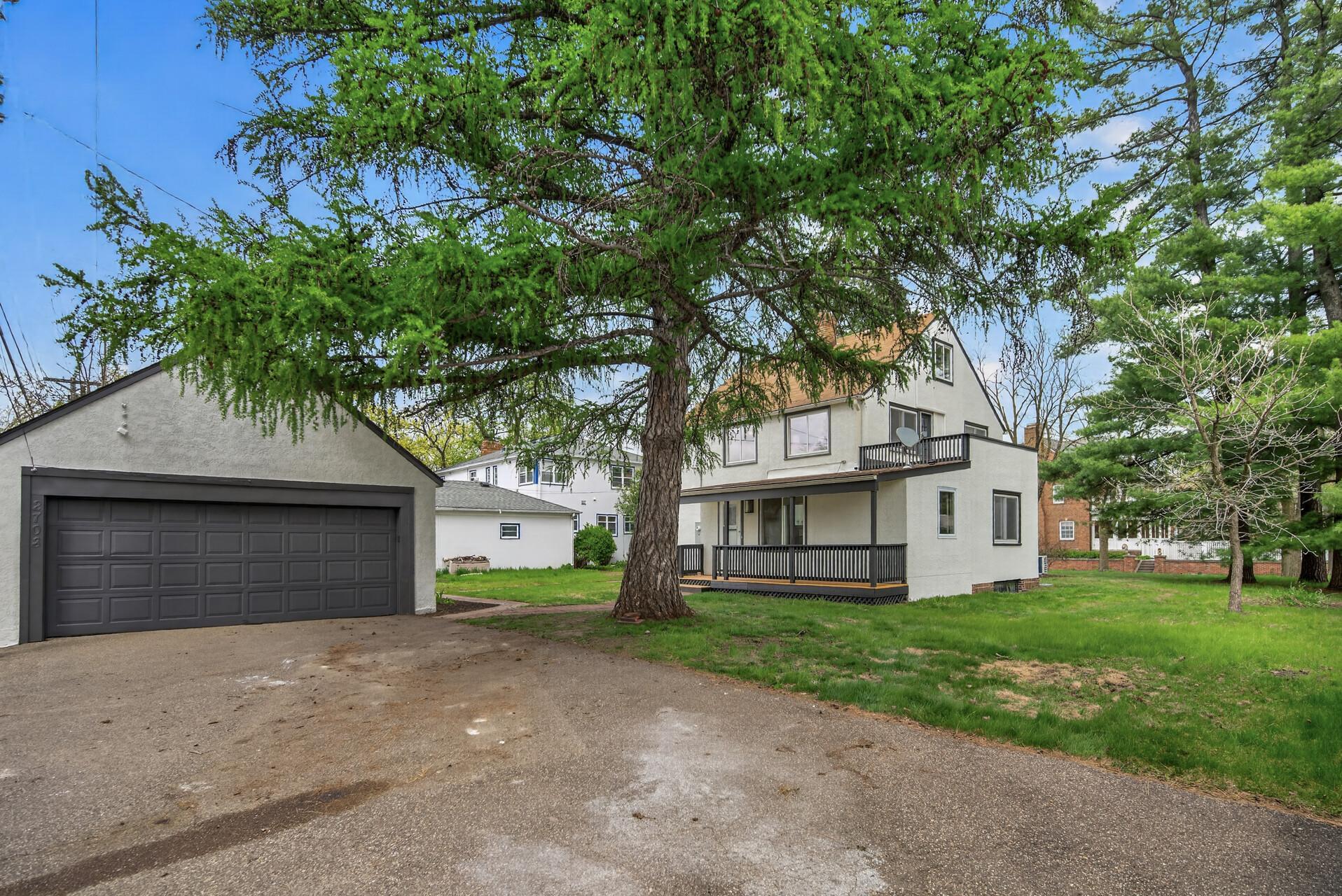 The detached two-car garage provides excellent storage and functionality, with newly completed drywall and a clean, pressure-washed floor.