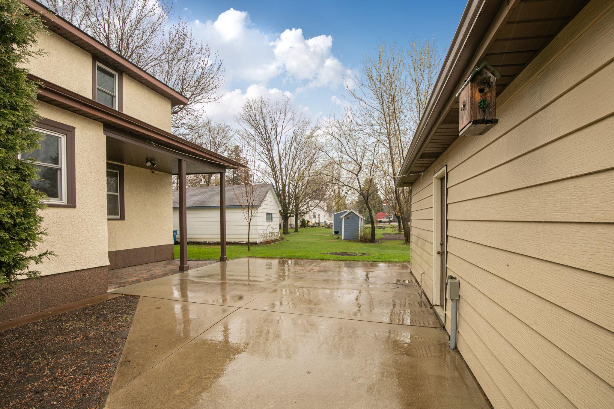 Concrete Patio Between the House and 3 Stall Garage