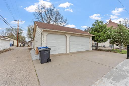Rare 3 car garage is insulated & finished for cars, boats, bikes and toys