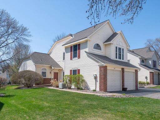 End-unit townhome with 3 bedrooms, 3 bathrooms, main-level living, and a screened porch in West Bloomington.