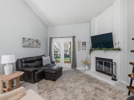 The Living Room has a patio door to the Screened Porch.