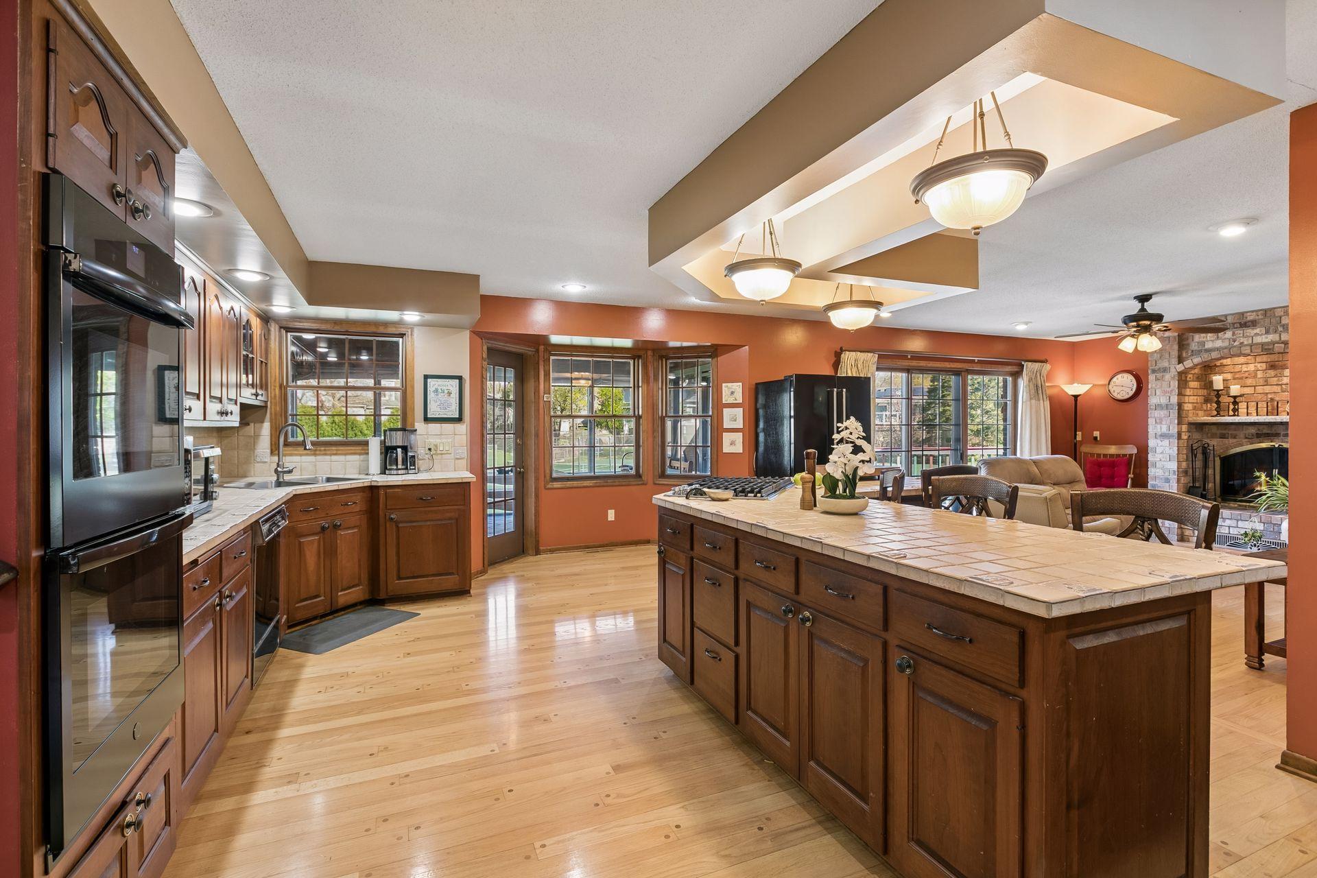 Sprawling kitchen steps right out to an awesome screened porch and two deck areas