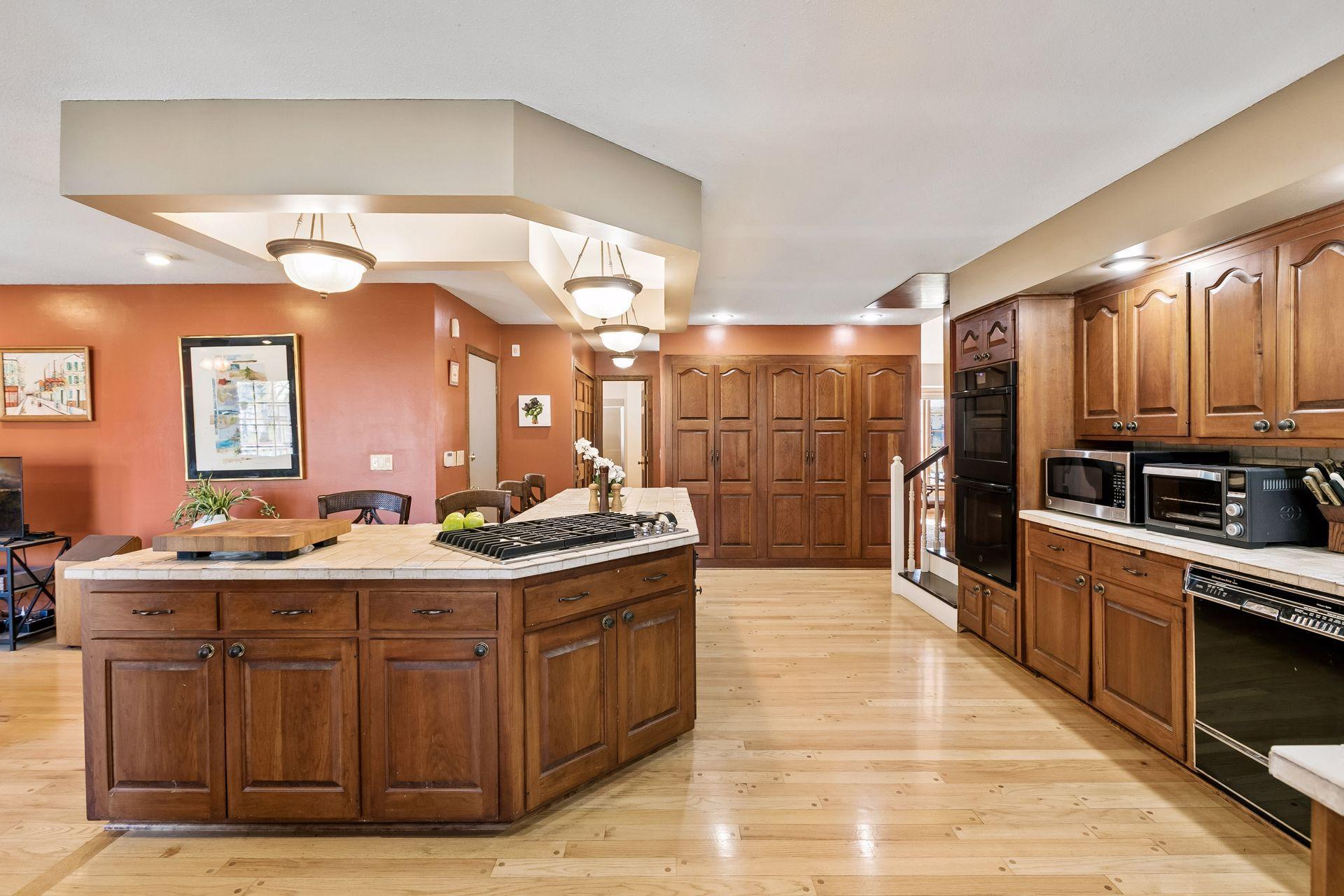 Storage for days with an added wall of cabinetry, plus new cooktop!