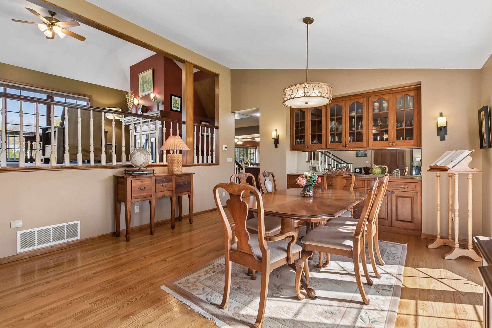 The dining space flows seamlessly between kitchen and upper floor