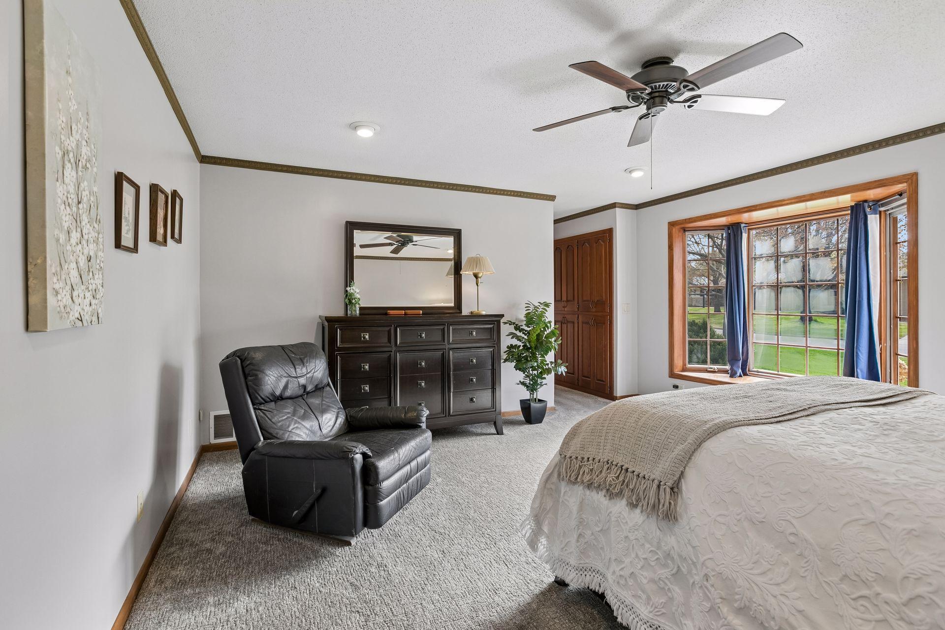 Primary bedroom includes a walkout to its own private balcony and a bay window