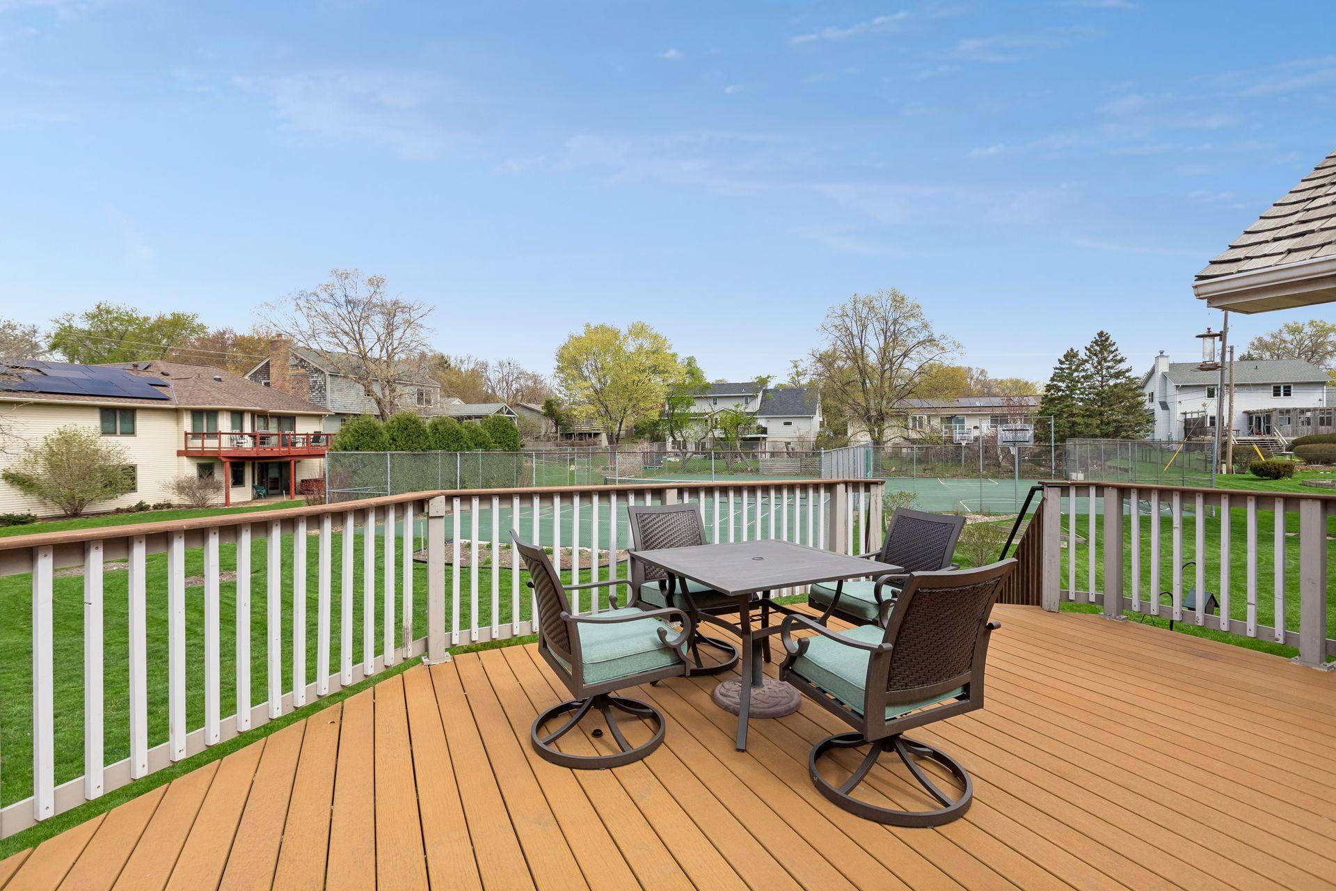 Main floor deck off of the screened porch has a stairway down to the lawn, and also up to the 2nd floor deck