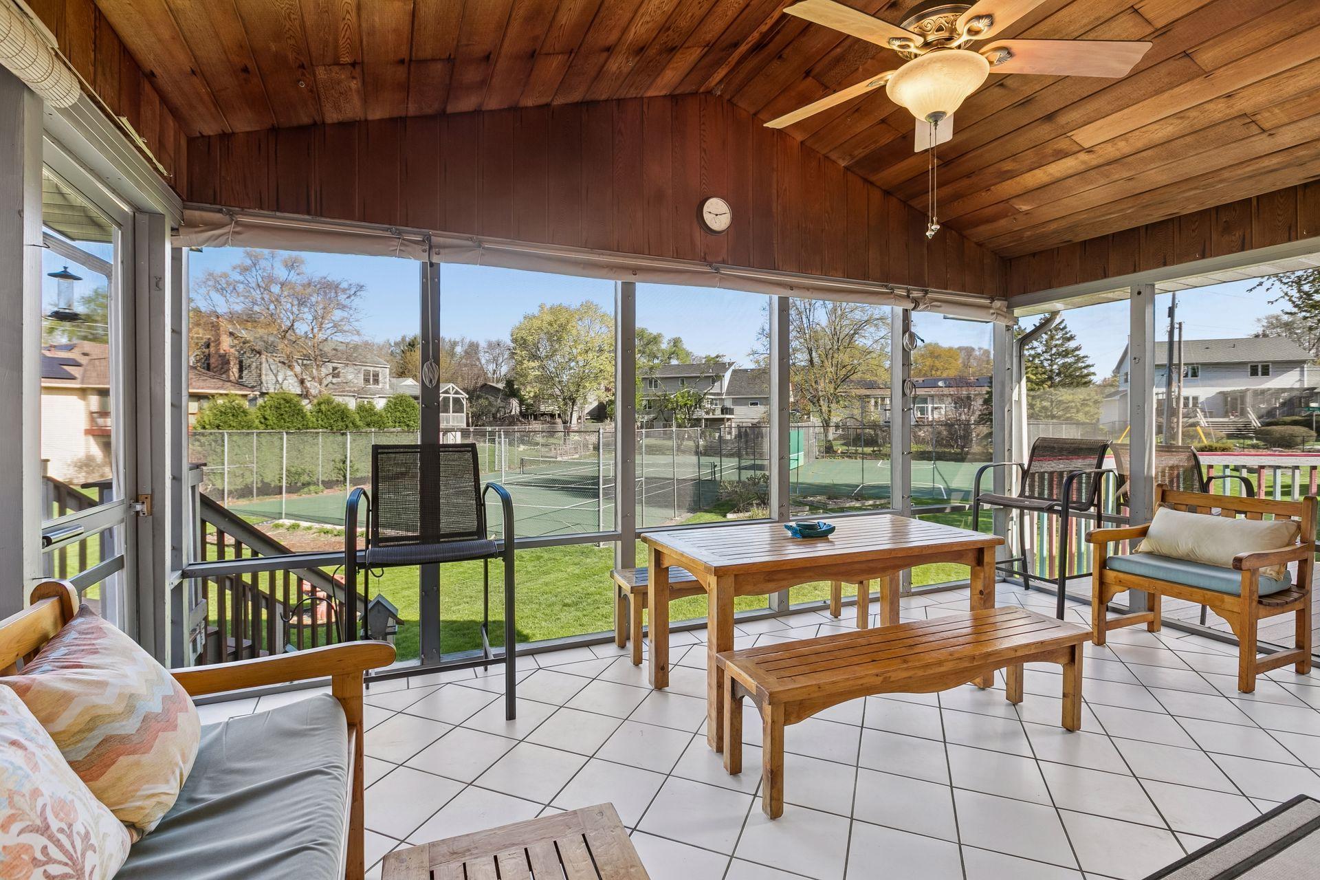 Wow, you will want to spend so much time out in this screened porch, overlooking the lawn and sport courts