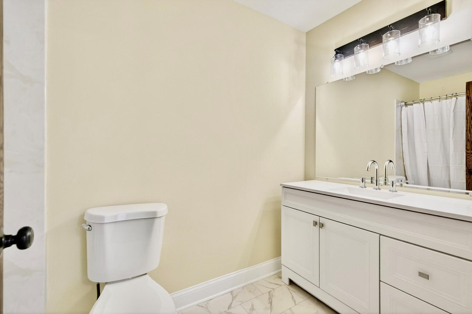 1 of 2 primary suite bathrooms