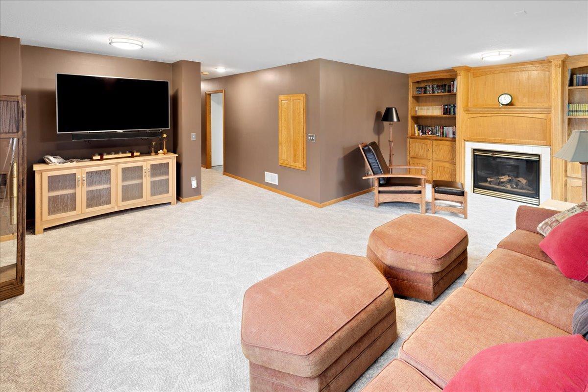 Gas burning Fireplace surrounded by custom built-ins