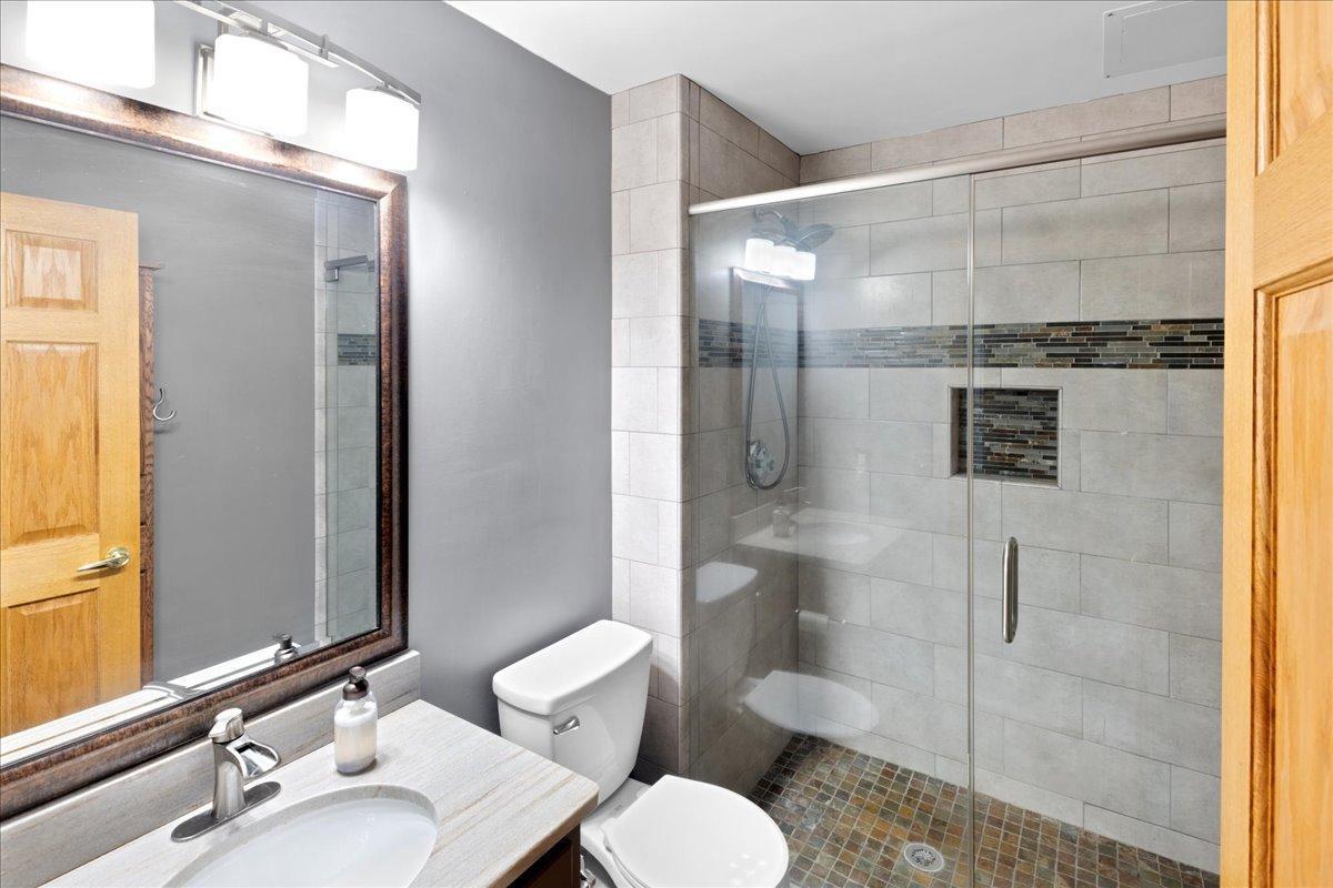 Lower level 3/4 Bath with custom walk-in tiled shower
