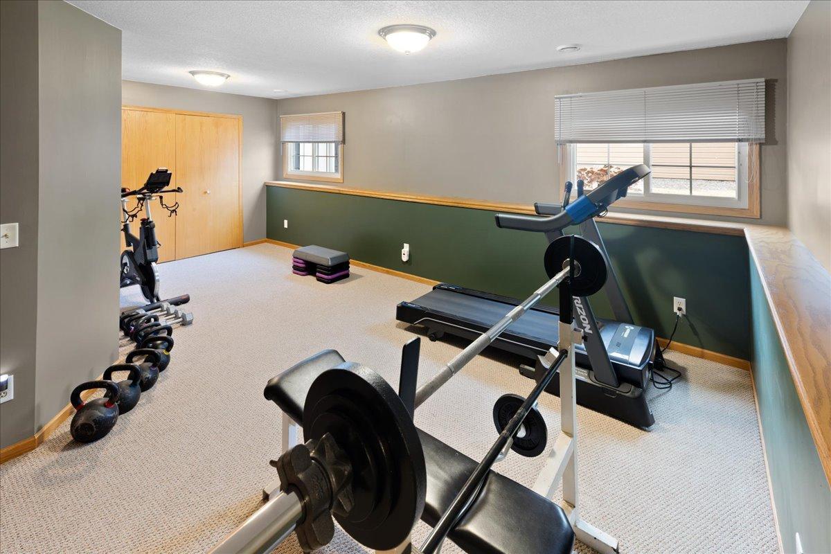 Flex Room is perfect for a 6th Bedroom, workout room, in-home Office, Kids Playroom. Large built-in Cabinet with doors for extra storage