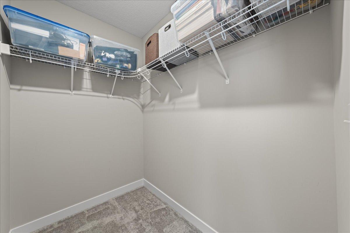 Upper level bedroom walk in closet