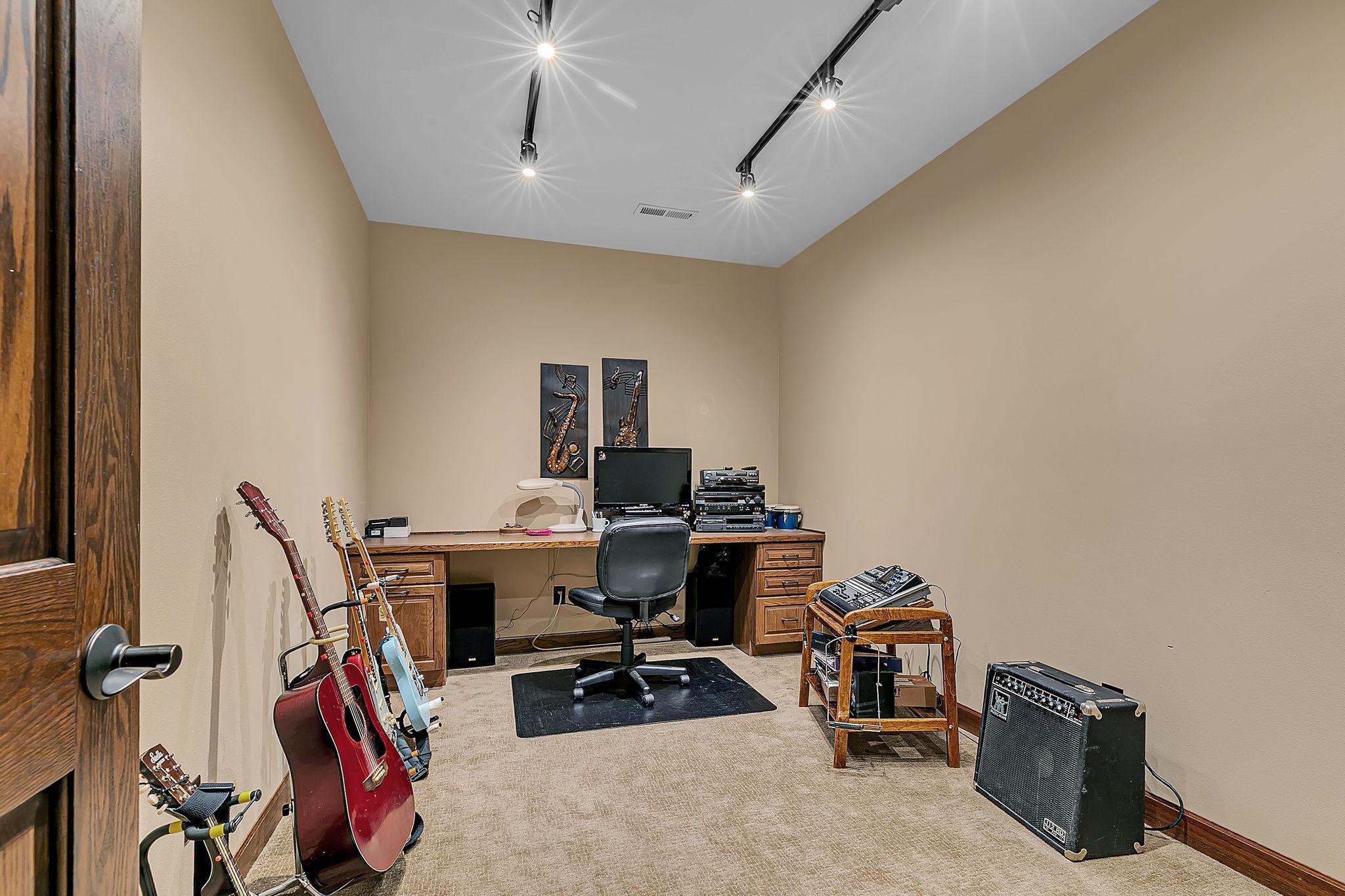 Additional lower level flex room currently used as a music room but would make great home office or exercise space
